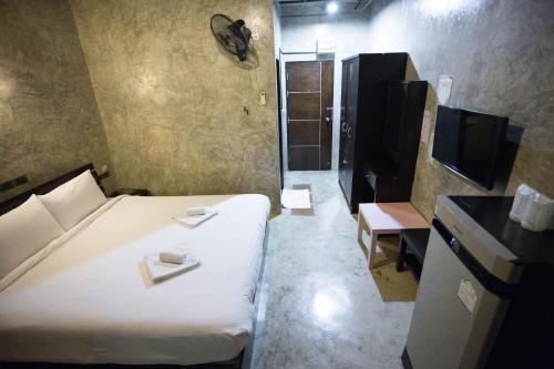 Łóżko lub łóżka w pokoju w obiekcie STAY MAYB Chiang Mai