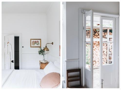 a bedroom with a white bed and an open door at The Main House @ Poets Lodge in Daylesford