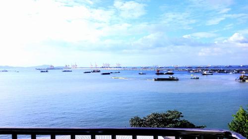 a large body of water with boats in it at โรงแรม ชาโตว์วิสต้า in Chon Buri