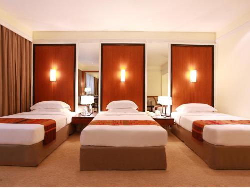 
A bed or beds in a room at Dusit Princess Chiang Mai
