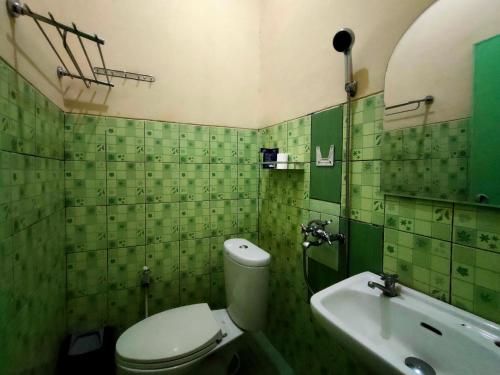 Ett badrum på Bakom Inn Syariah