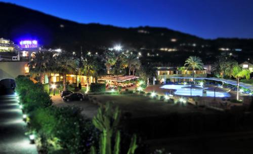 a view of a resort with a pool at night at Hotel Aktea in Lipari
