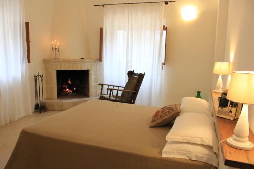 A bed or beds in a room at Masseria Zambardo