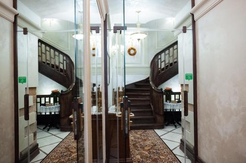 
a room with a staircase leading to a stair case at Apart-hotel Horowitz in Lviv
