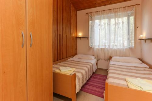 Posteľ alebo postele v izbe v ubytovaní Apartman Mavarcica A4