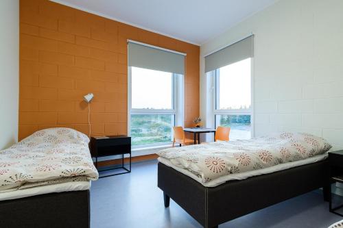 Säng eller sängar i ett rum på Märjamaa spordihoone