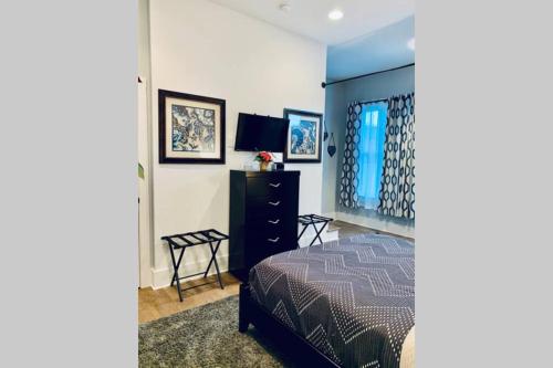 a bedroom with a bed and a dresser at cowart in Chattanooga