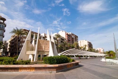 a large building in a city with buildings at Modern apartment in Torrevieja, 60 m², near beaches in Torrevieja