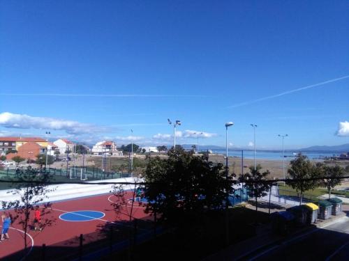 a view of a basketball court in a park at Charming Apartment in El Grove, Sea View in O Grove