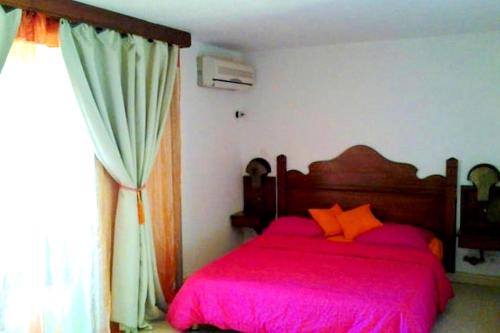Postel nebo postele na pokoji v ubytování Studio charmant à Sainte-Anne avec piscine privée, 25 m²