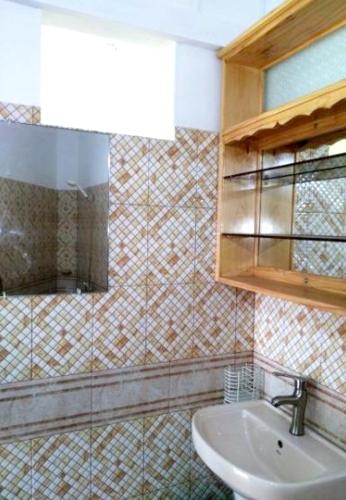 a bathroom with a sink and a mirror at Charming Apartment in Pereybere with Shared Pool, 75 m² in Pereybere