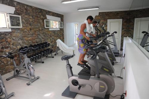 a man on a treadmill in a gym at Camping Village Rosselba Le Palme in Portoferraio