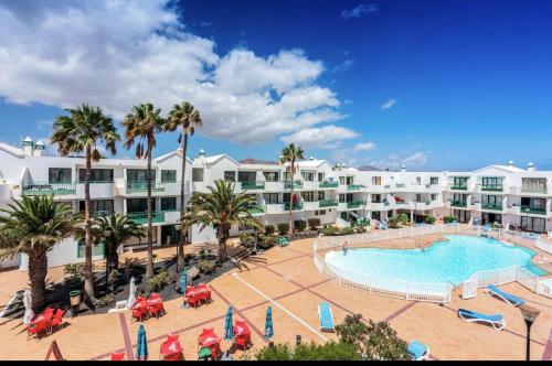 A view of the pool at Studio with shared pool furnished terrace and wifi at Costa Teguise or nearby