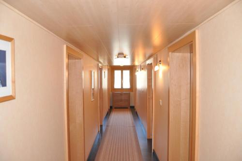a corridor of a hallway with a long hallway at Gazauner Hof in Sankt Gallenkirch