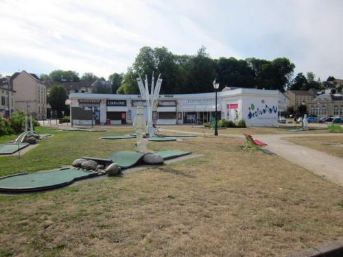 a group of surfboards sitting on the grass in front of a building at Maison avec spa à They-Sous-Montfort, accueillant et moderne in They-sous-Montfort