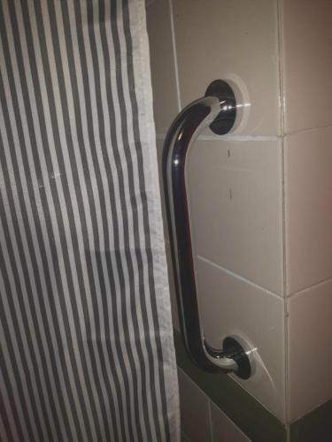 a bathroom stall door with a shower curtain at Modern Apartment in Matalascañas with Shared Pool in Matalascañas