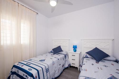 Giường trong phòng chung tại Casa El Palmar 2