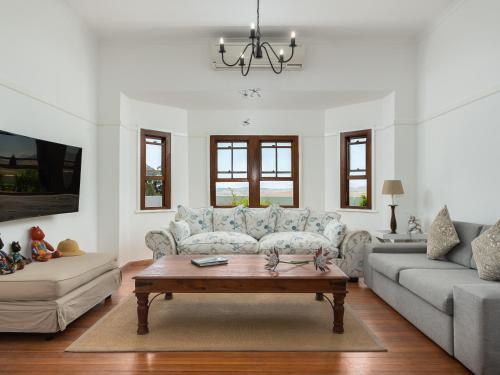 a living room with a couch and a coffee table at Abbotts Hill in Malmesbury
