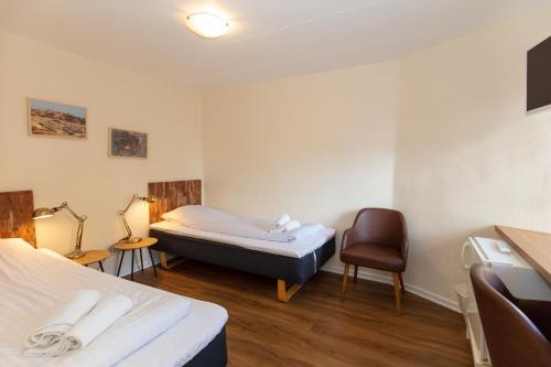Ένα ή περισσότερα κρεβάτια σε δωμάτιο στο Foldens Hotel