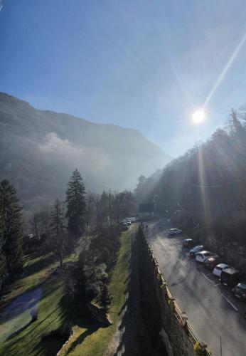 a road with a bunch of cars parked on it at Appart Le Chili- Quartier thermal- Parc remarquable - Linge fourni in Luz-Saint-Sauveur