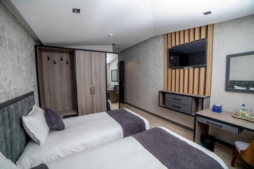 Ένα ή περισσότερα κρεβάτια σε δωμάτιο στο Hotel NEW YORK Tashkent