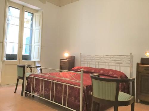 Cama ou camas em um quarto em GoodStay Dimora San Lazzaro