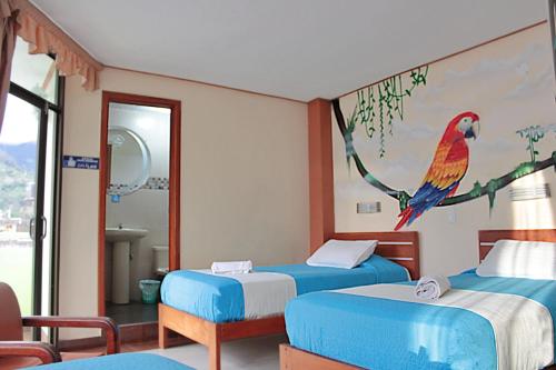 Ένα ή περισσότερα κρεβάτια σε δωμάτιο στο Hostal Dulce Amanecer