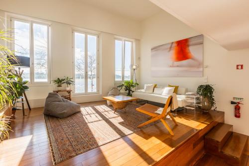 a living room with a couch and a table at River house in Porto