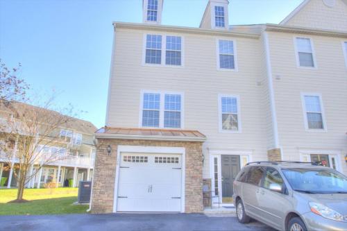 a van parked in front of a house with a white garage at 34 Pier Point Dr, Millville in Millville