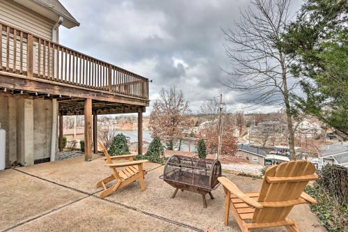 two chairs and a table on a patio at Deck and Fire Pit Lake-View Osage Beach Home! in Osage Beach