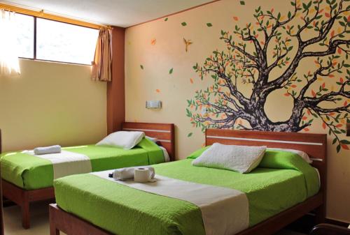 A bed or beds in a room at Hostal Dulce Amanecer