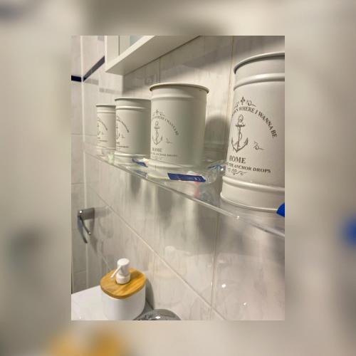 a shelf with pots and pans in a kitchen at Daheim in Essen in Essen