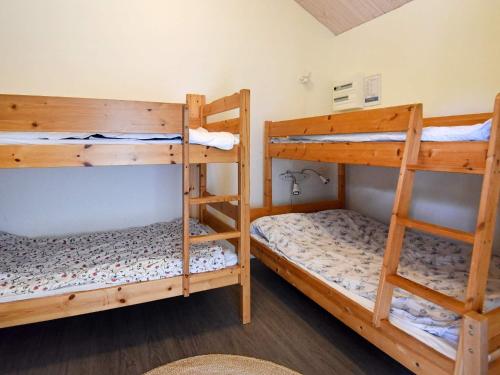 a room with two bunk beds in a room at 4 person holiday home in Brålanda in Brålanda