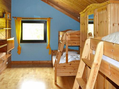 a bedroom with a bunk bed and a window at 10 person holiday home in EIDSVÅG-By Traum in Rød