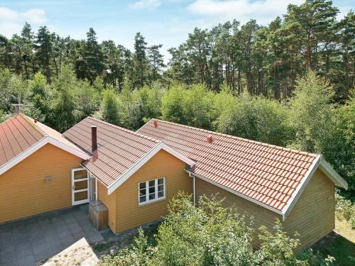 an aerial view of a house with an orange roof at Lovely Cottage in Aakirkeby with Sauna in Vester Sømarken