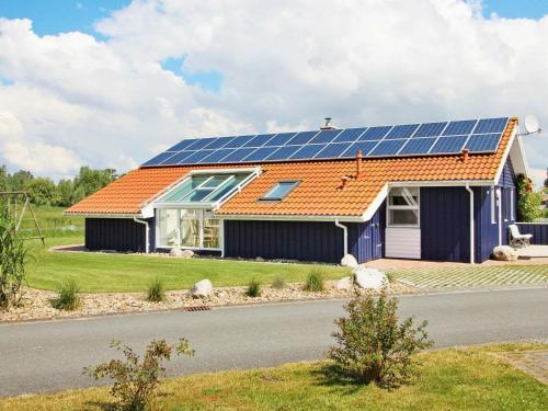 a house with solar panels on the roof at 12 person holiday home in Otterndorf in Otterndorf