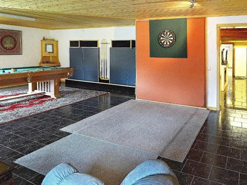 a room with a ping pong table and a pool table at 17 person holiday home in MELLERUD-By Traum in Dals Rostock