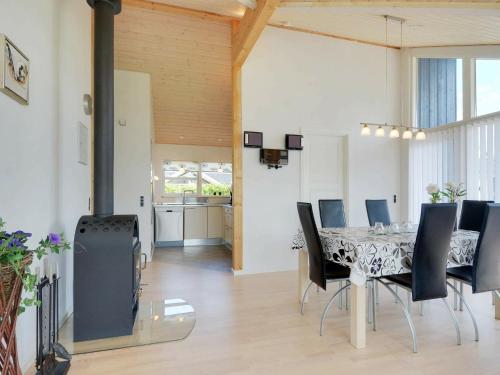 a dining room with a table and chairs at Luxury Retreat with Spa - By Traum Ferienwohnungen in Hemmet
