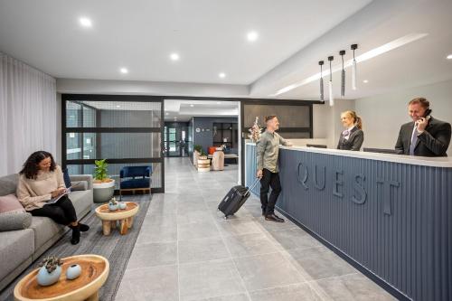 a man standing at a counter in an office at Quest Wangaratta in Wangaratta