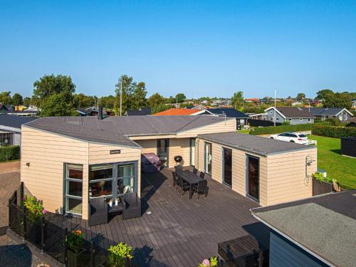 an aerial view of a house with a deck at 6 person holiday home in Juelsminde in Sønderby