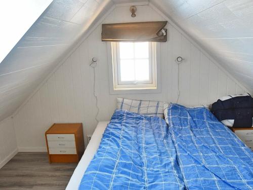 Giường trong phòng chung tại Holiday Home Goddevegen