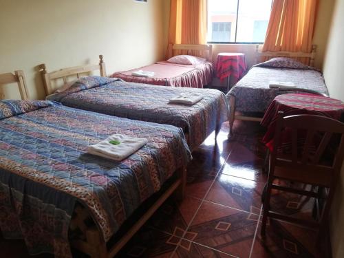 Postel nebo postele na pokoji v ubytování Artesonraju Hostel Huaraz