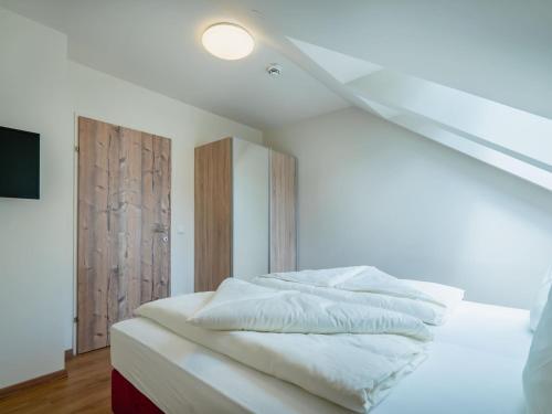 Gulta vai gultas numurā naktsmītnē Attractive Apartment in Gosau with shared Sauna