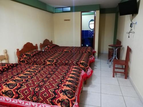 Postel nebo postele na pokoji v ubytování Artesonraju Hostel Huaraz