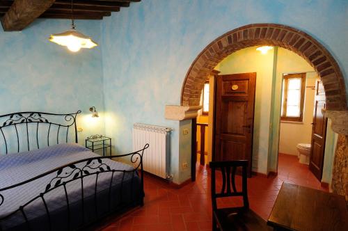 מיטה או מיטות בחדר ב-Agriturismo I Monti