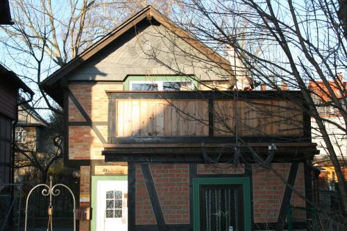 a house with a balcony on top of it at Harz-Chill Wernigerode in Wernigerode