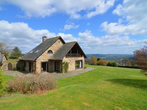 an old stone house on a green field at Villa with 5 bedrooms and 4 bathrooms in Lierneux