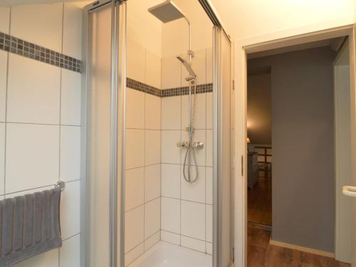 a shower with a glass door in a bathroom at Chalet with Valley Views, in Malmedy