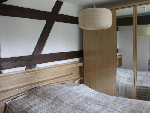 a bedroom with two twin beds and a lamp at Quaint Apartment in Reddelich in Reddelich