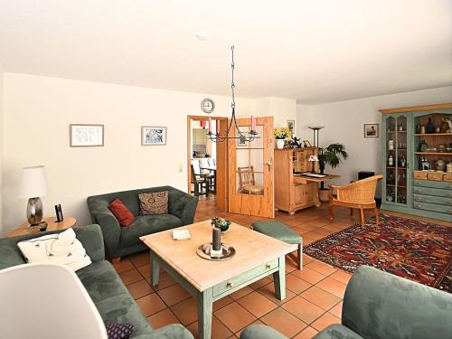 a living room with couches and a table at Cottage in Rinchnach Bavaria near the forest in Rinchnach